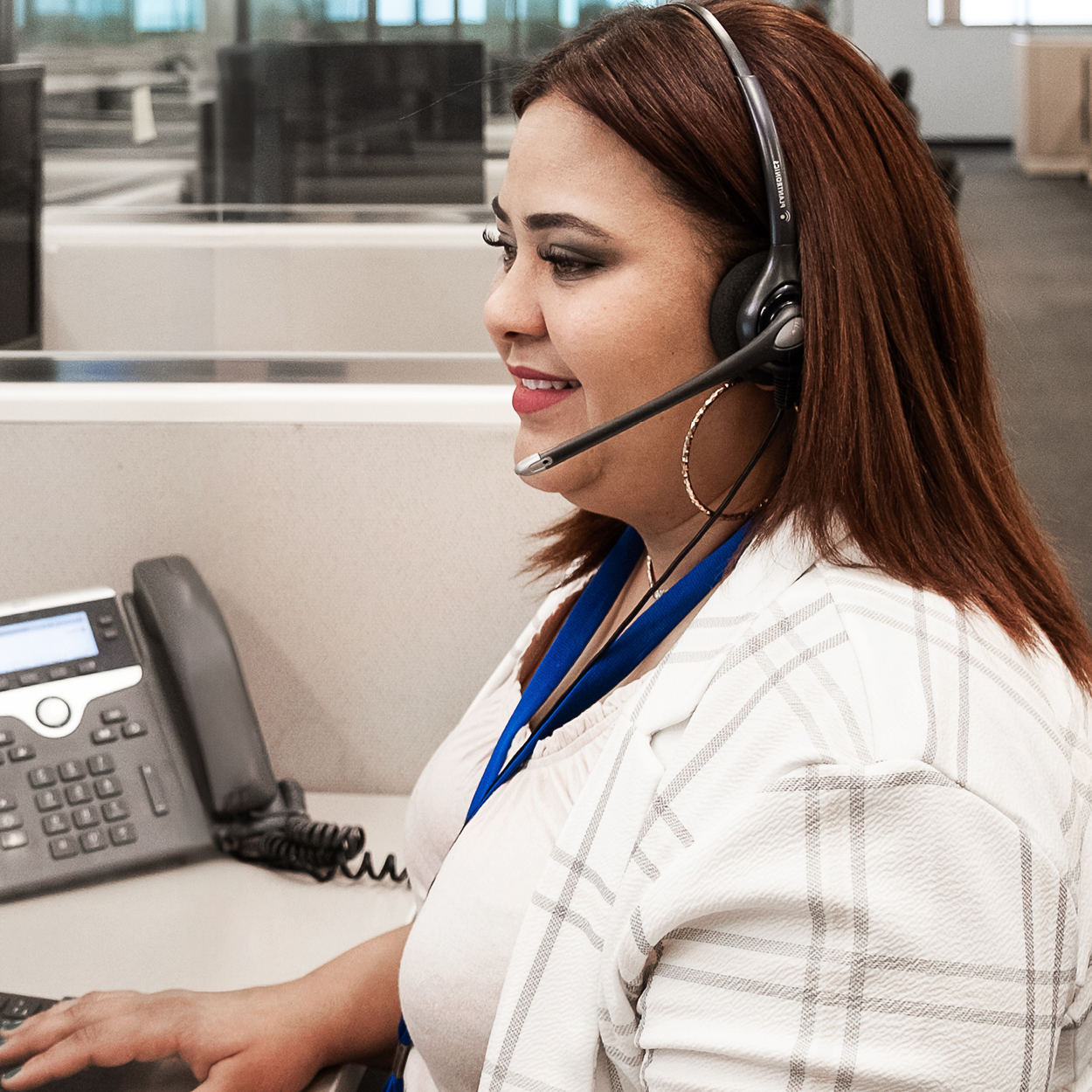 Smiling woman on headset